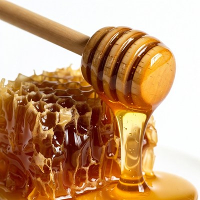 Honey Dripping from Wooden Dipper