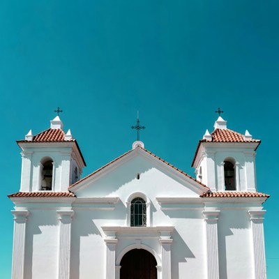 White colonial church with twin bell towers