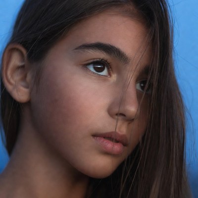 Young girl with brown hair profile