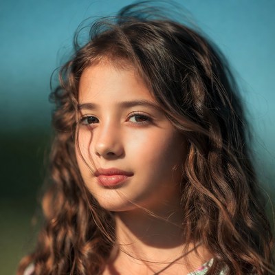 Young girl with curly brown hair