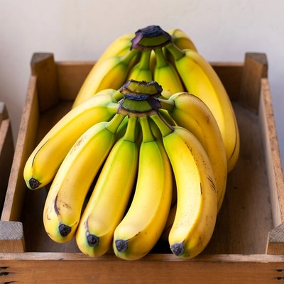 Fresh bananas in wooden crate