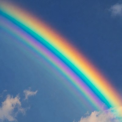 Vibrant Rainbow in Blue Sky