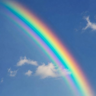 Vibrant Rainbow in Blue Sky