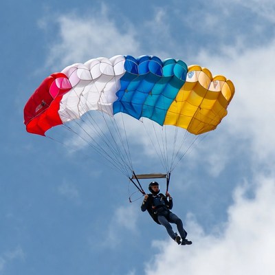 Skydiver with multicolored parachute