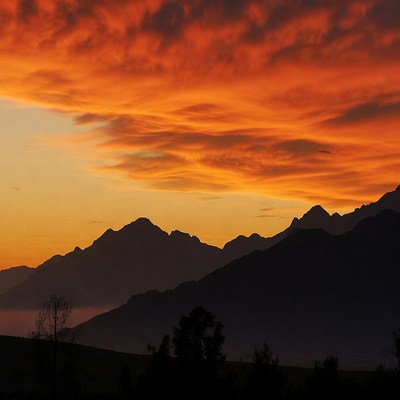 Sunset over silhouetted mountains