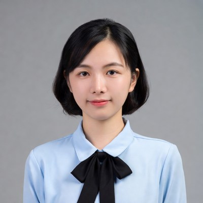 Asian woman in blue shirt with bowtie