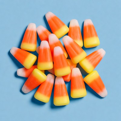 Candy corn pile on blue background