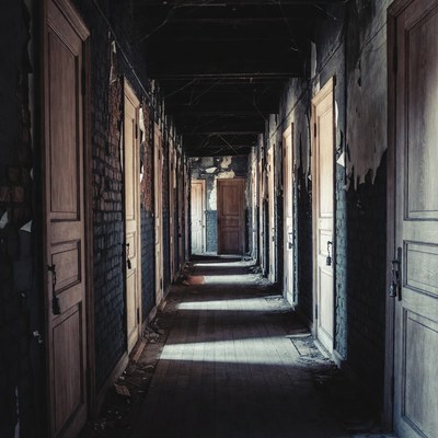 Abandoned Hallway with Wooden Doors