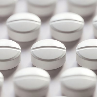 White Pills Scattered on Surface