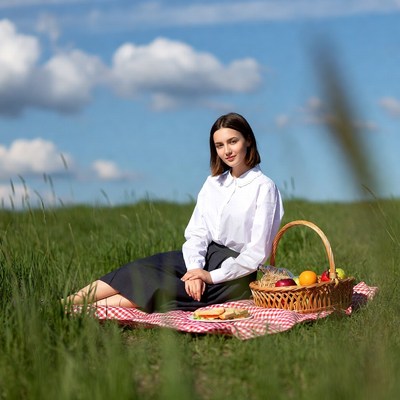 Woman with picnic basket in grass