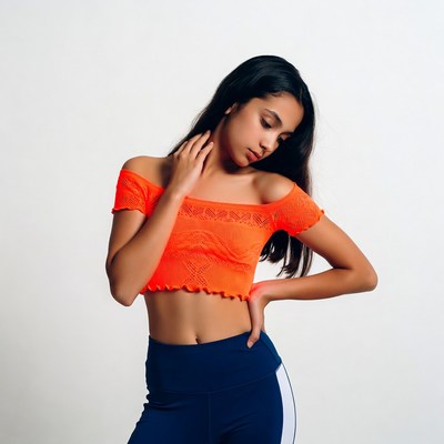 Young woman in orange off-shoulder top