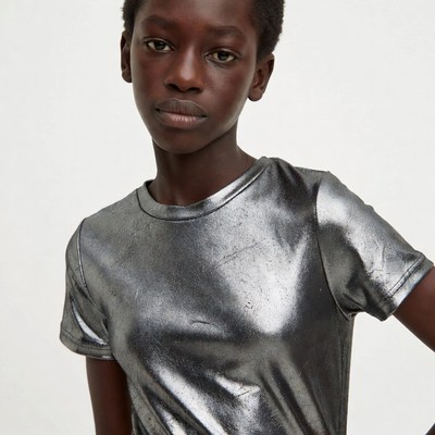 African girl in silver t-shirt