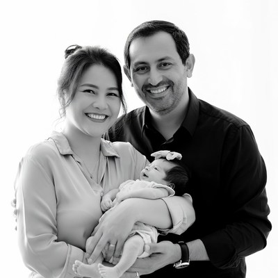 Family holding newborn baby