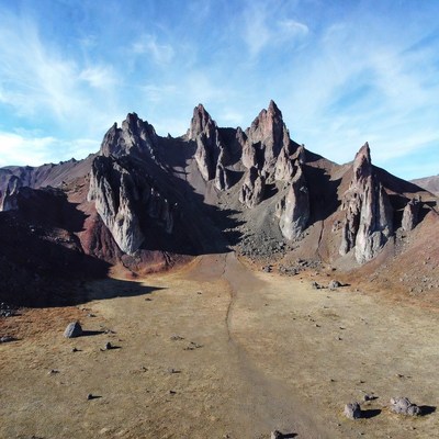Jagged Red Mountains in Desert Valley