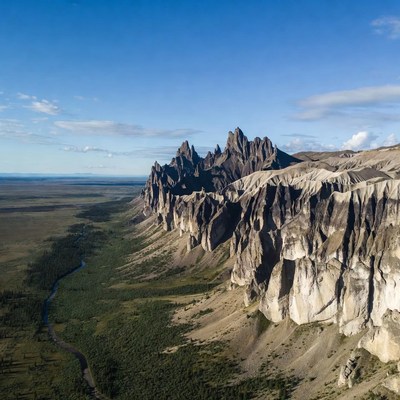 Dramatic basalt cliffs over green valley