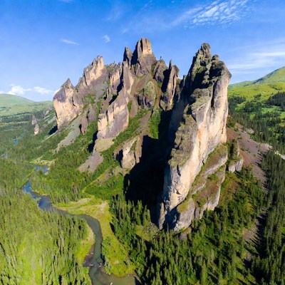Jagged Rock Formation in Green Valley