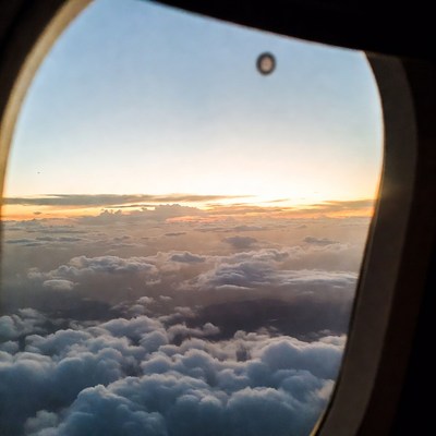 Airplane Window Sunset Clouds
