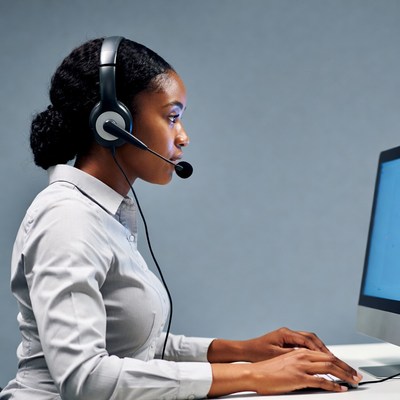 African-American woman using headset at computer