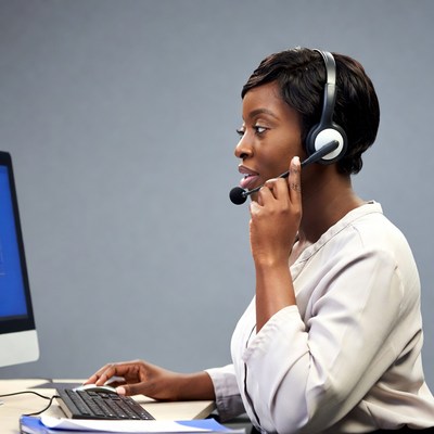 African-American woman on headset call