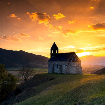 Stone Chapel at Sunset on Hill
