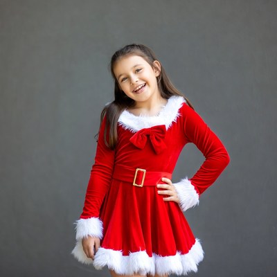 Girl in red Santa dress smiling