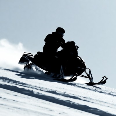 Man riding snowmobile in snow