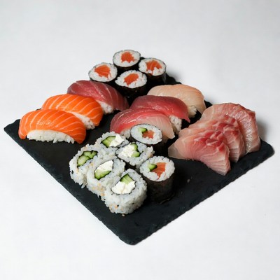 Assorted Sushi Rolls on Black Slate