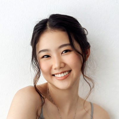Smiling Asian woman with updo