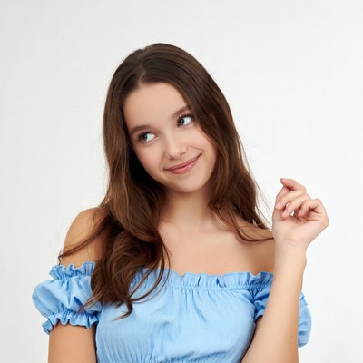 Young woman tilting head curiously