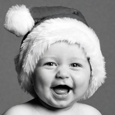 Baby laughing in Santa hat