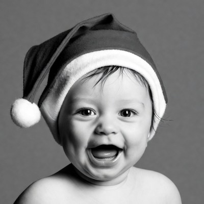 Baby smiling in Santa hat
