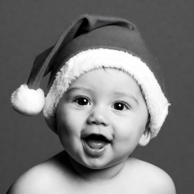Baby smiling in Santa hat