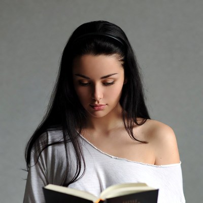 Woman reading book with headband