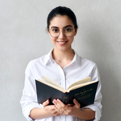 Smiling woman reading book
