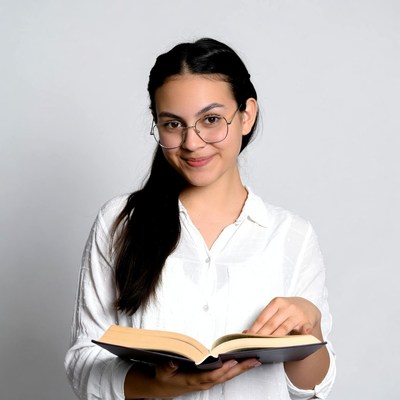 Young woman reading book