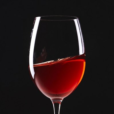 Red Wine Glass on Black Background