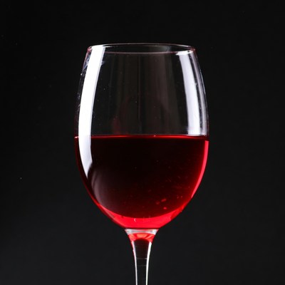 Red Wine Glass on Black Background