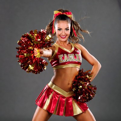 Cheerleader with pom poms posing