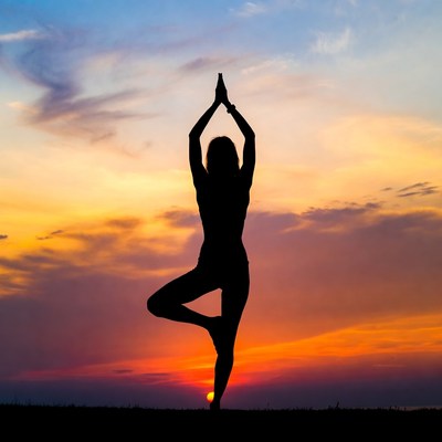 Woman in Tree Pose Silhouette at Sunset