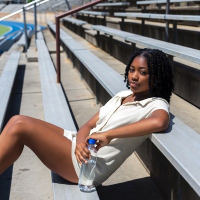 African-American woman on stadium bleachers