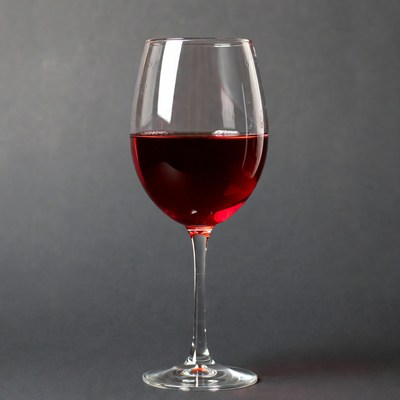 Red Wine Glass on Gray Background