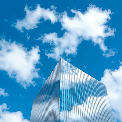 Glass Skyscraper Reflecting Clouds