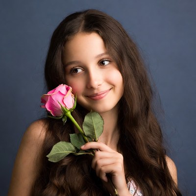 Girl holding pink rose