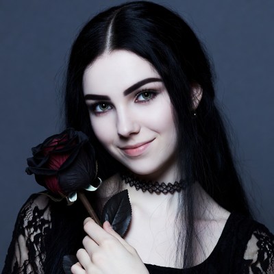 Woman holding black rose