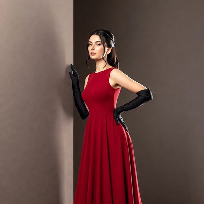 Woman in red dress with black gloves