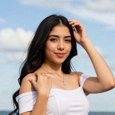 Latina woman touching hair outdoors