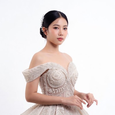Asian woman in beaded wedding gown