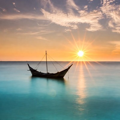 Traditional boat on calm sea at sunset