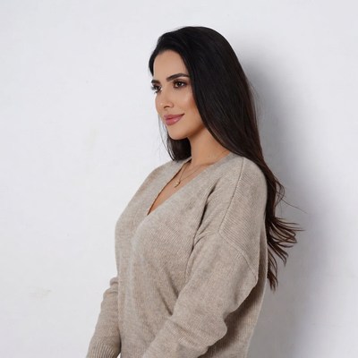 Profile of woman in beige sweater