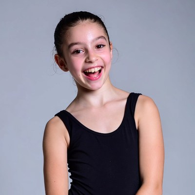 Smiling girl in black tank top